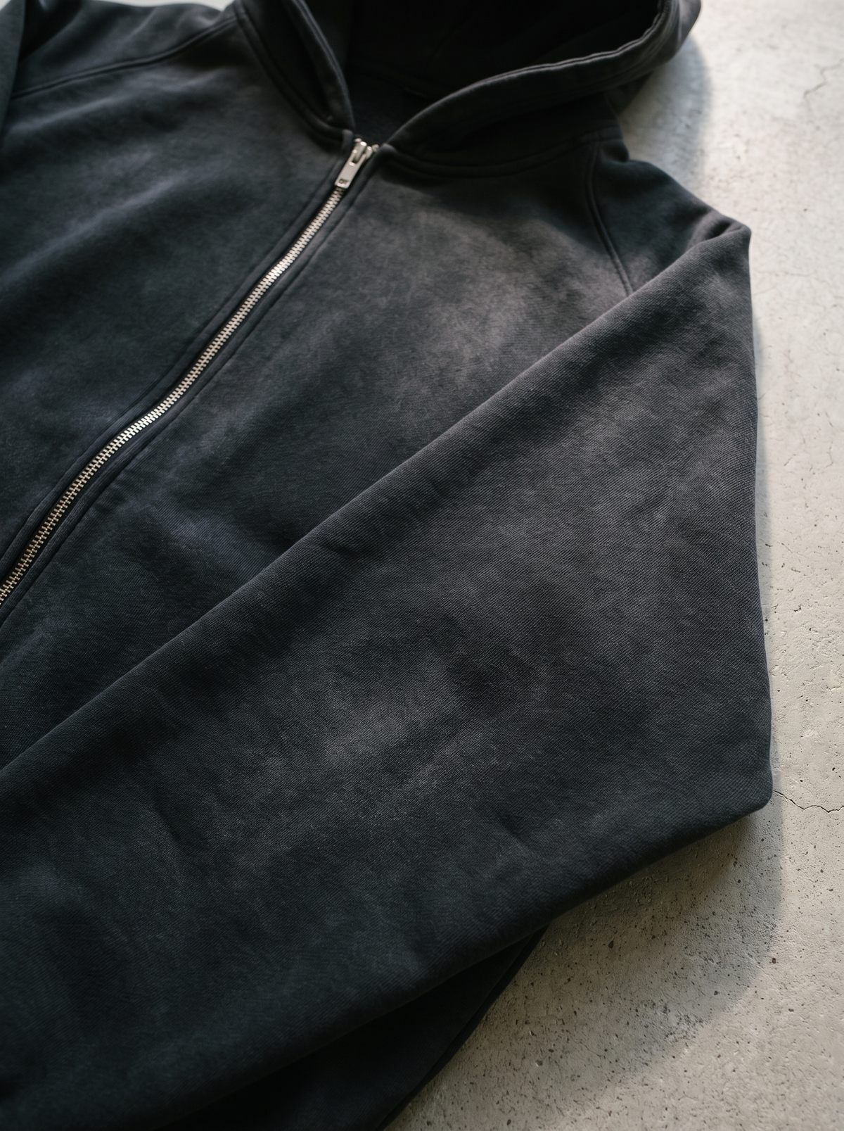 Close up of the sunfaded black cotton fleece