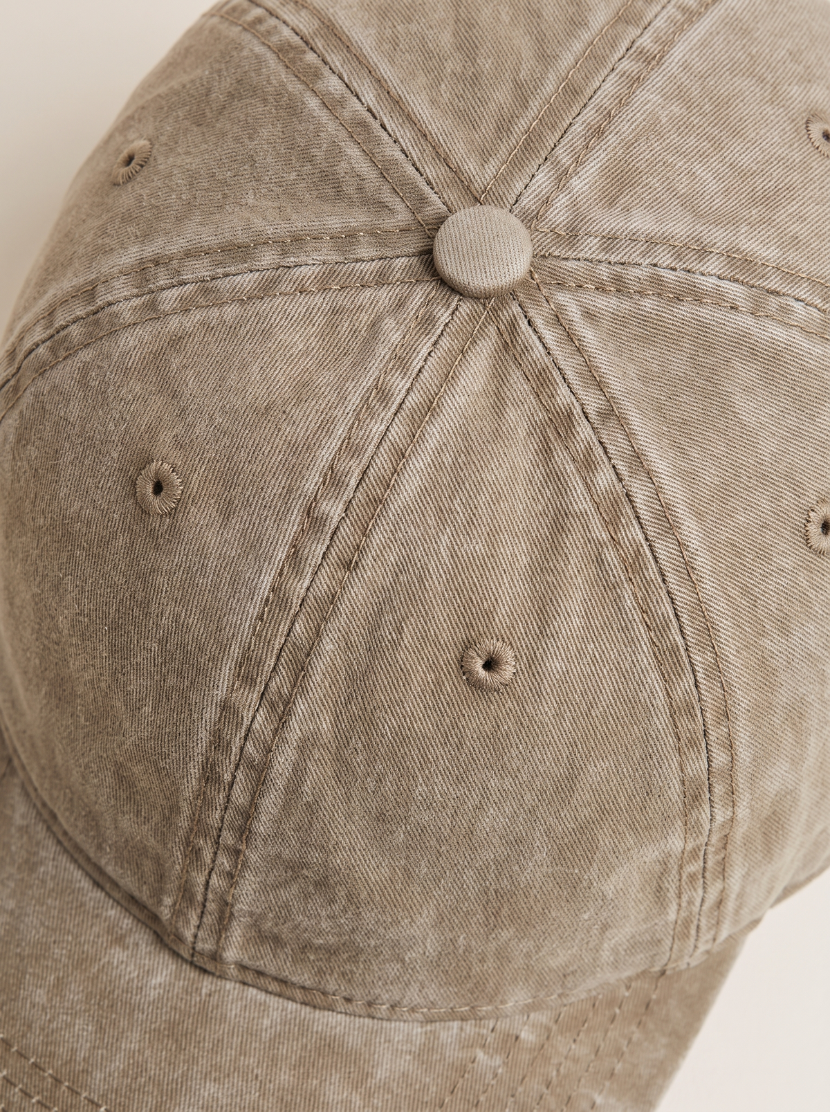 Close up of the washed cotton on the khaki baseball cap