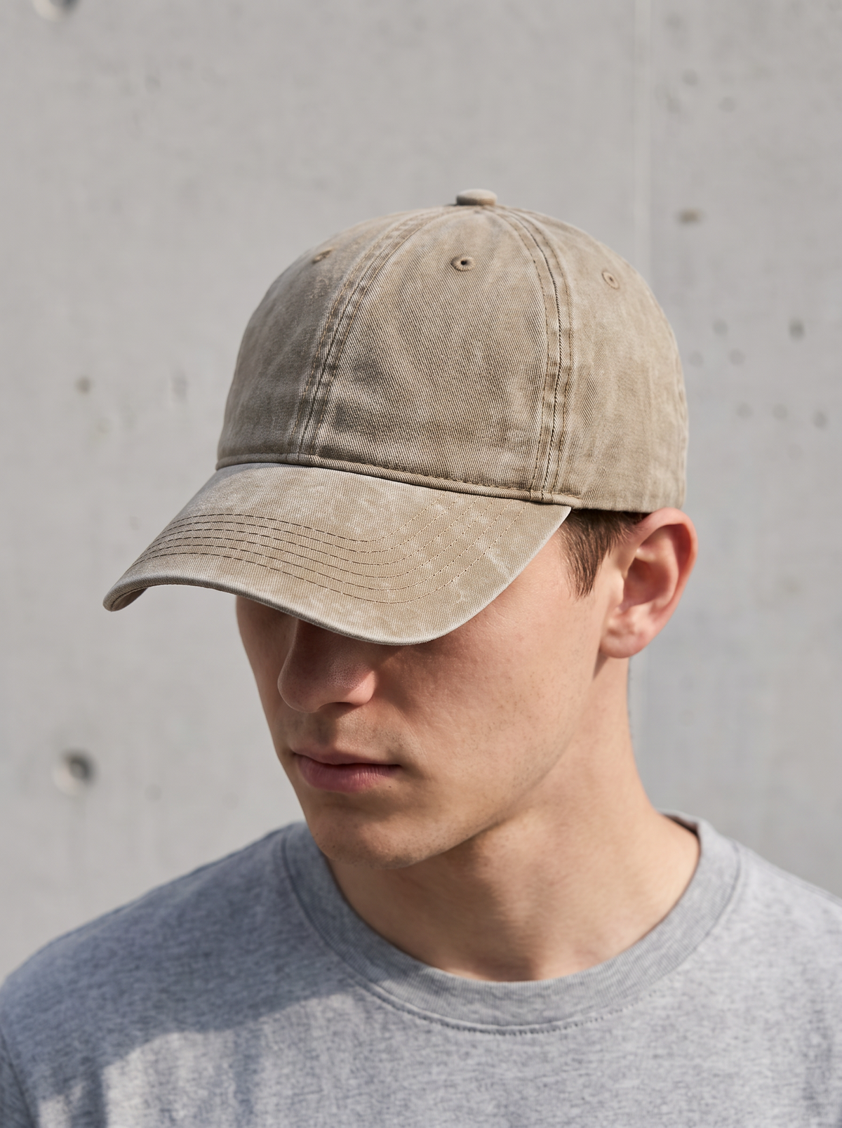 Khaki washed vintage baseball cap worn by a model